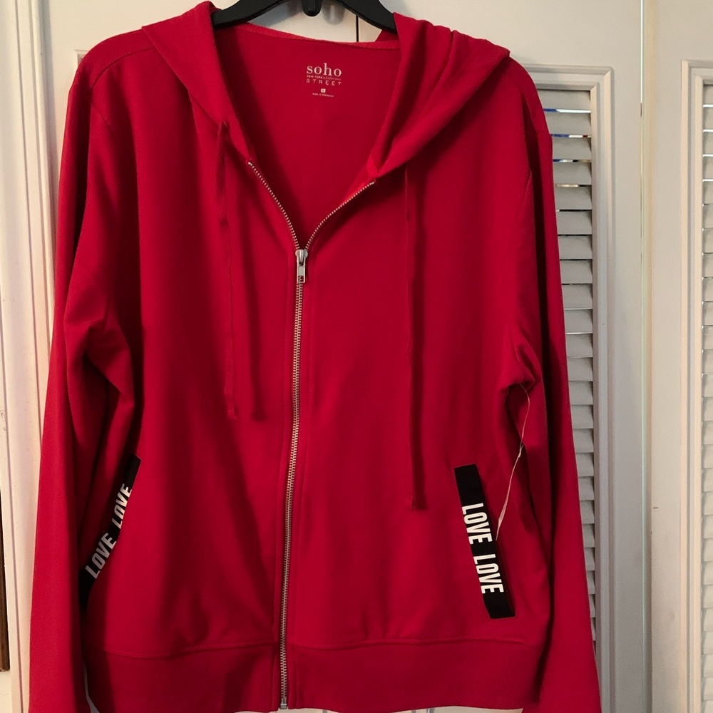 Zip front hooded jacket with the word love love on it. Comfortable and soft.
